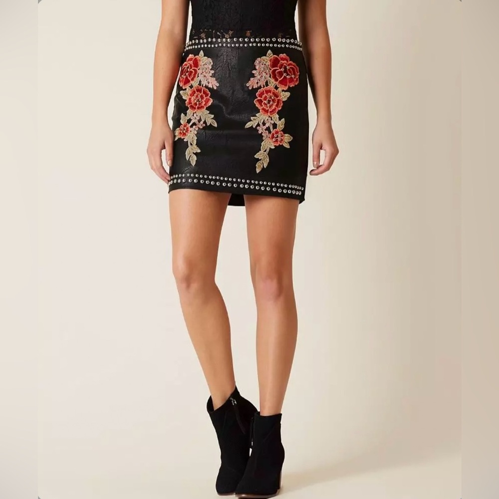 Romeo & Juliet Couture Black Skirt with Red Floral Design